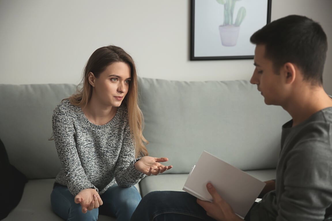 Male Psychologist Working with Patient in Office